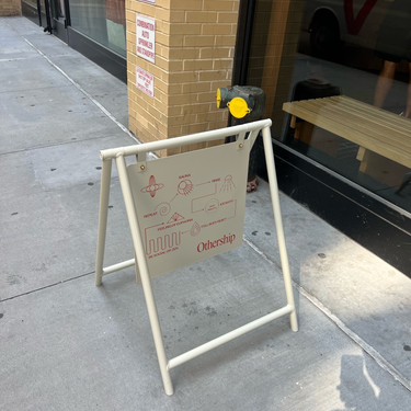 Othership Flatiron Sidewalk Sign Back