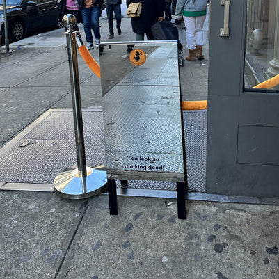 Mirror Sidewalk Sign for Save the Duck