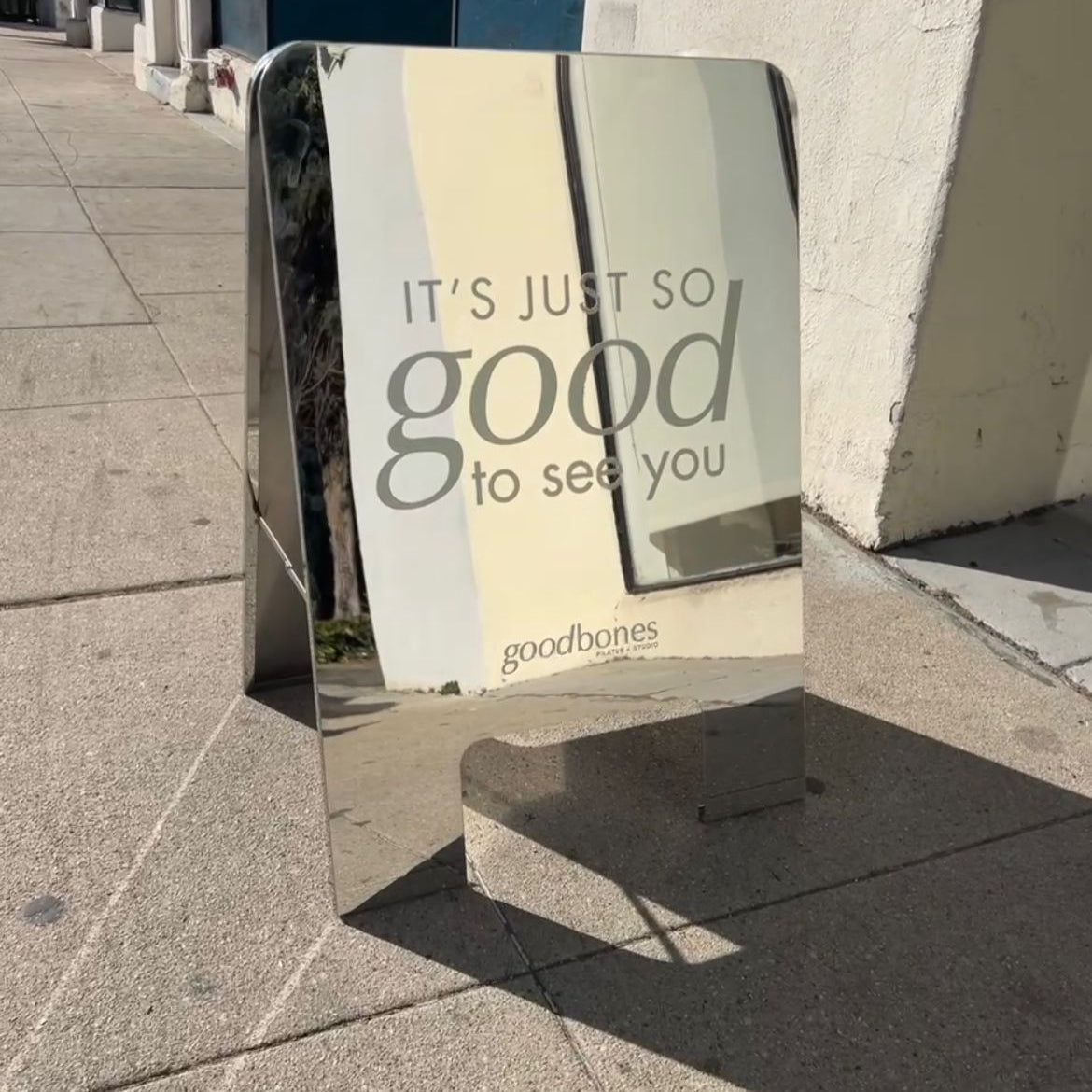 Good Bones Pilates Rounded Mirrored Sidewalk Sign