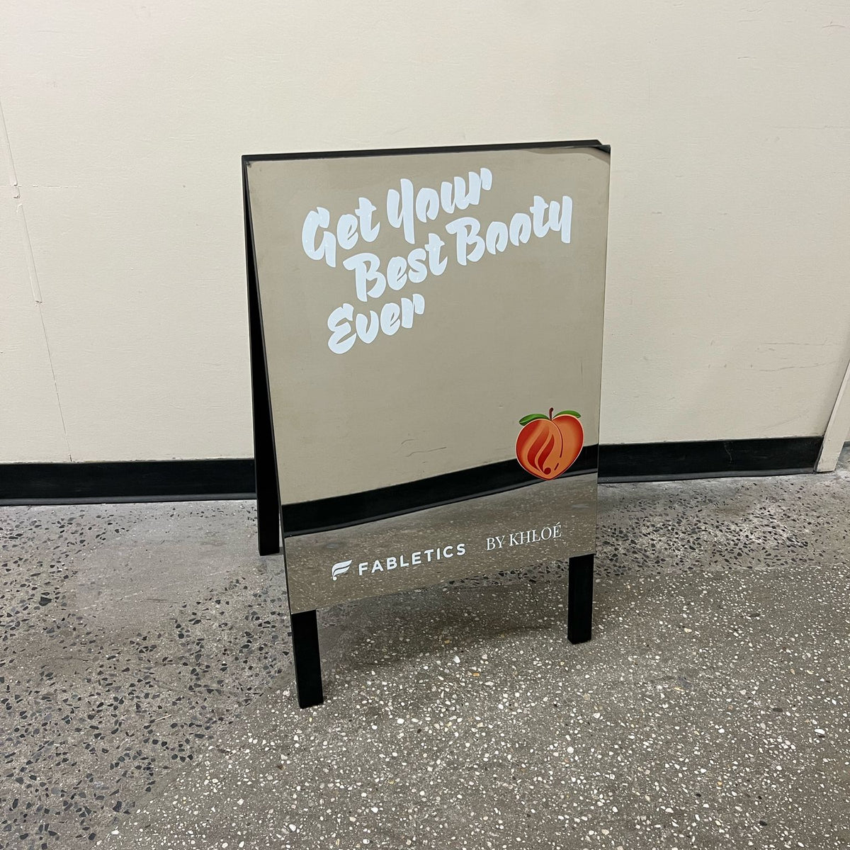 Mirrored A-frame sign with Get Your Best Body Ever lettering.