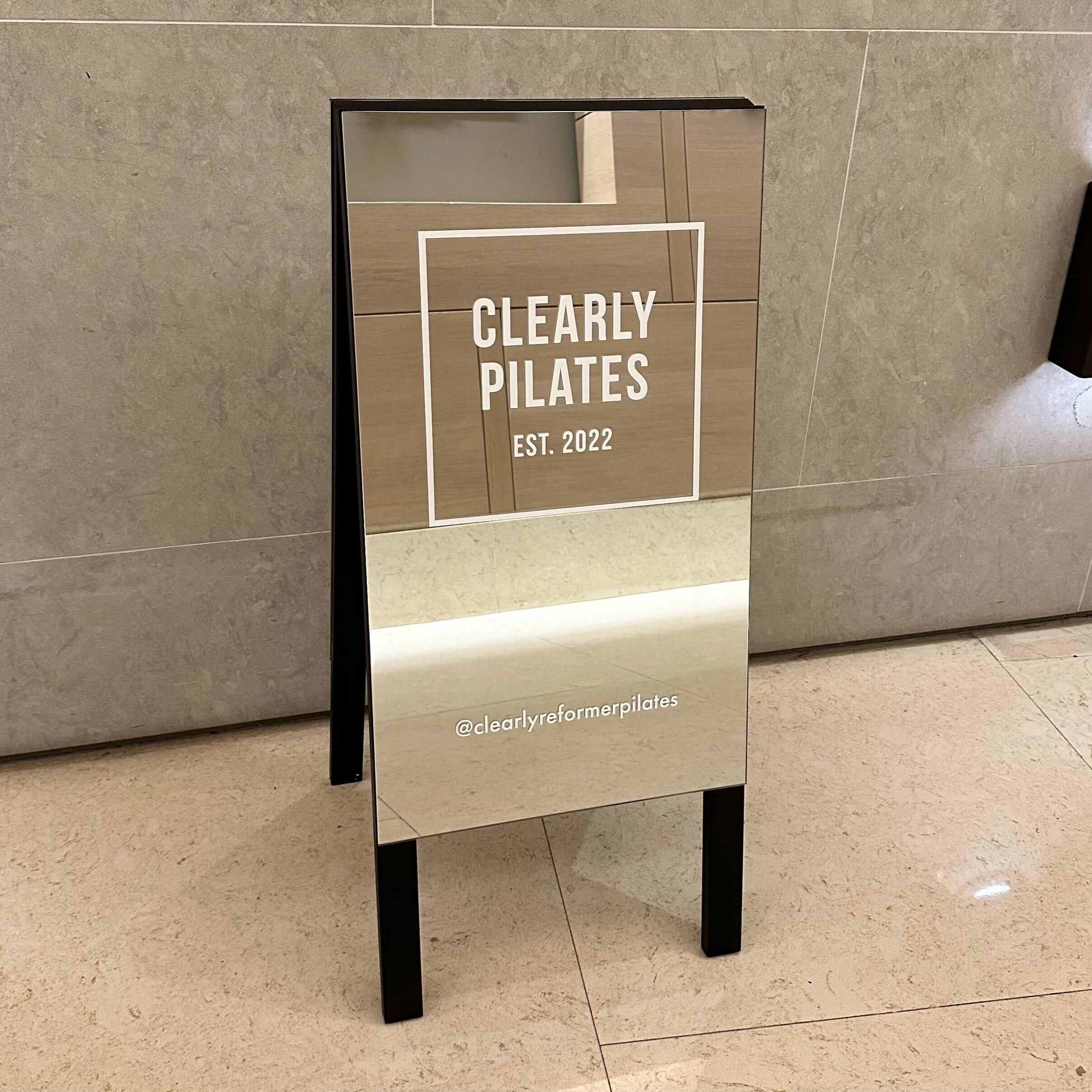 A-Frame Sidewalk Sign Mirrored Clearly Pilates Close Up