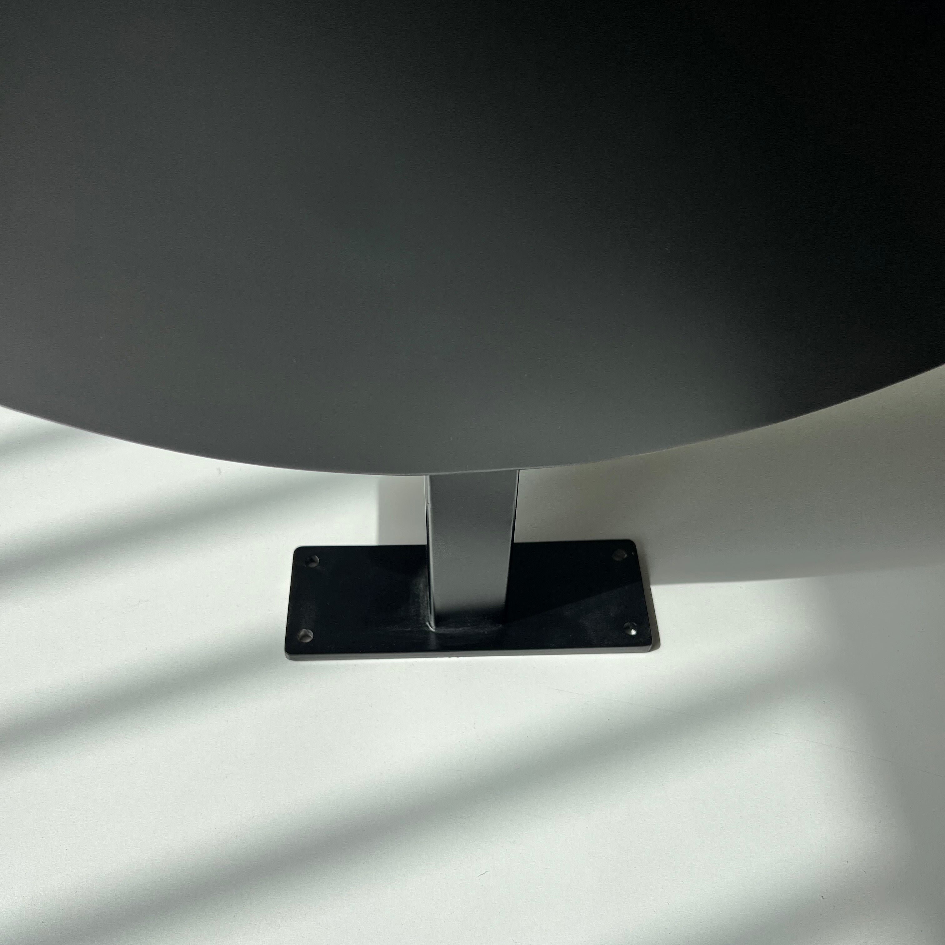 Black Circular Round Wall Sign Close Up