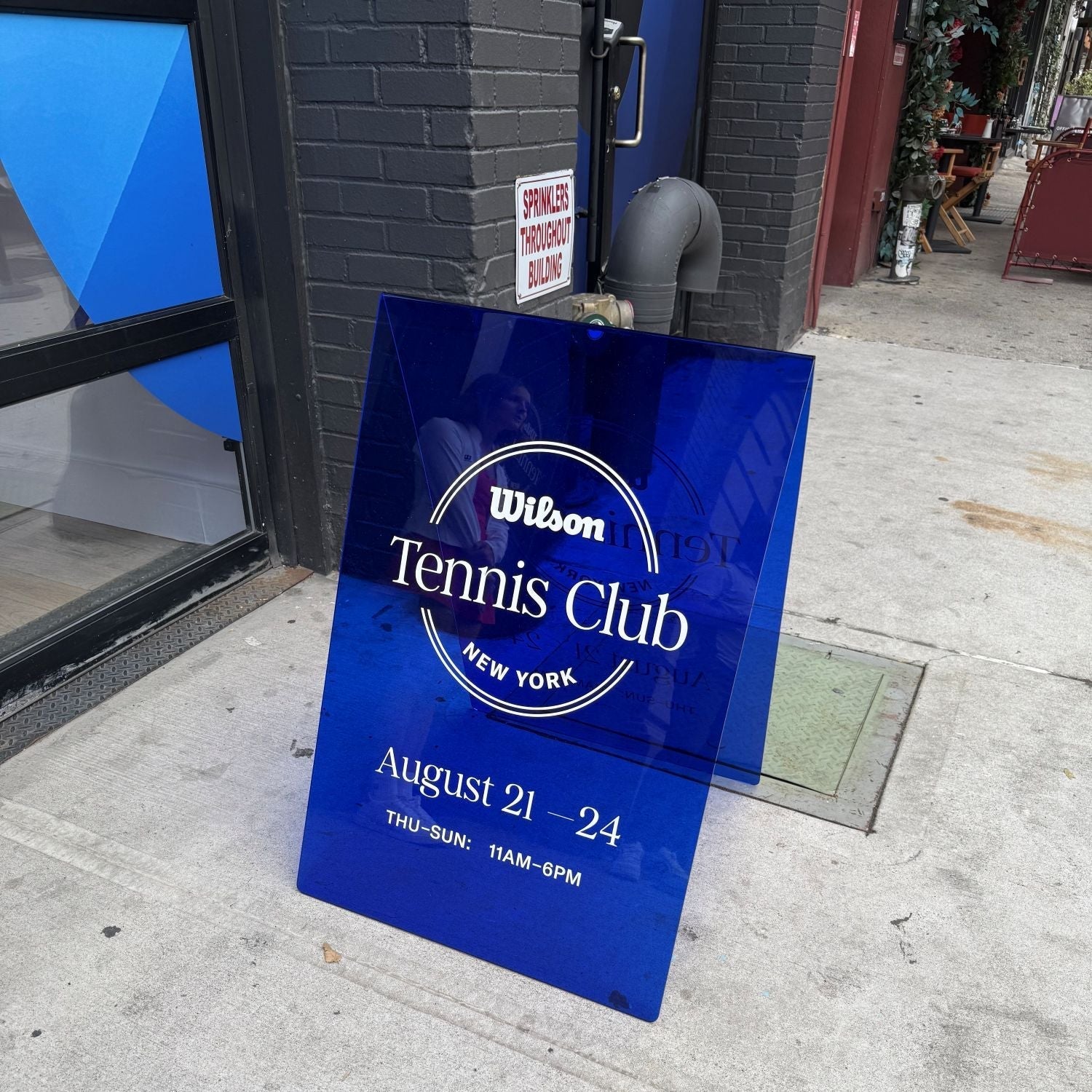 Transparent acrylic A-frame sidewalk sign for clear visibility