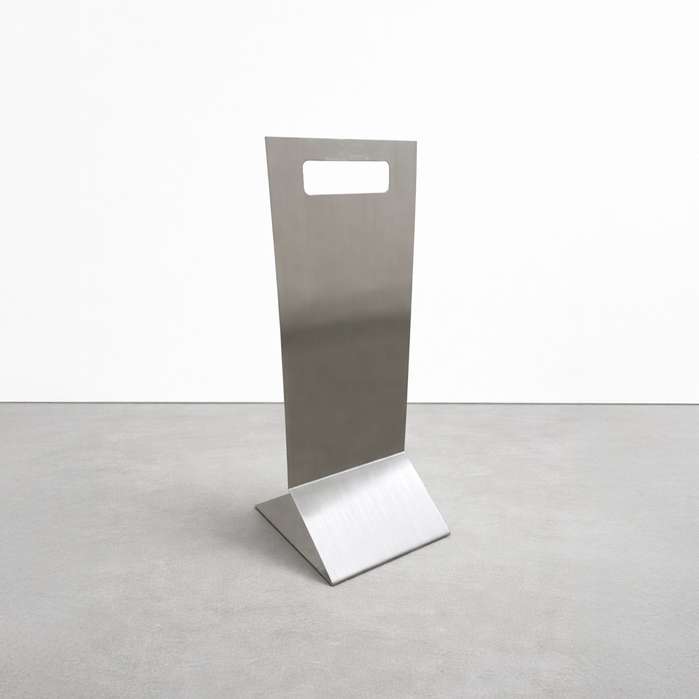 Stainless Steel stand with a rectangular top and square base on a light gray background