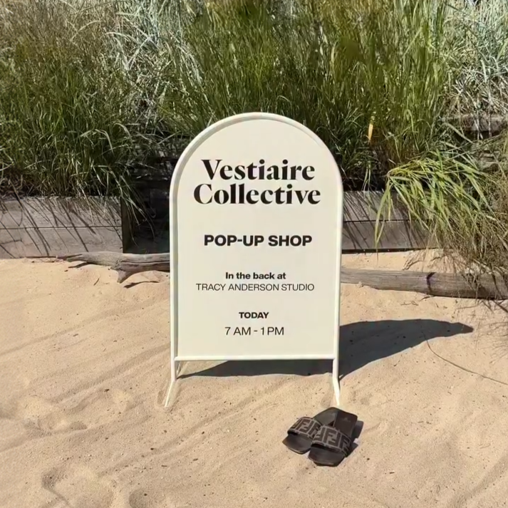 Rounded cream stainless steel standing sign with curved design