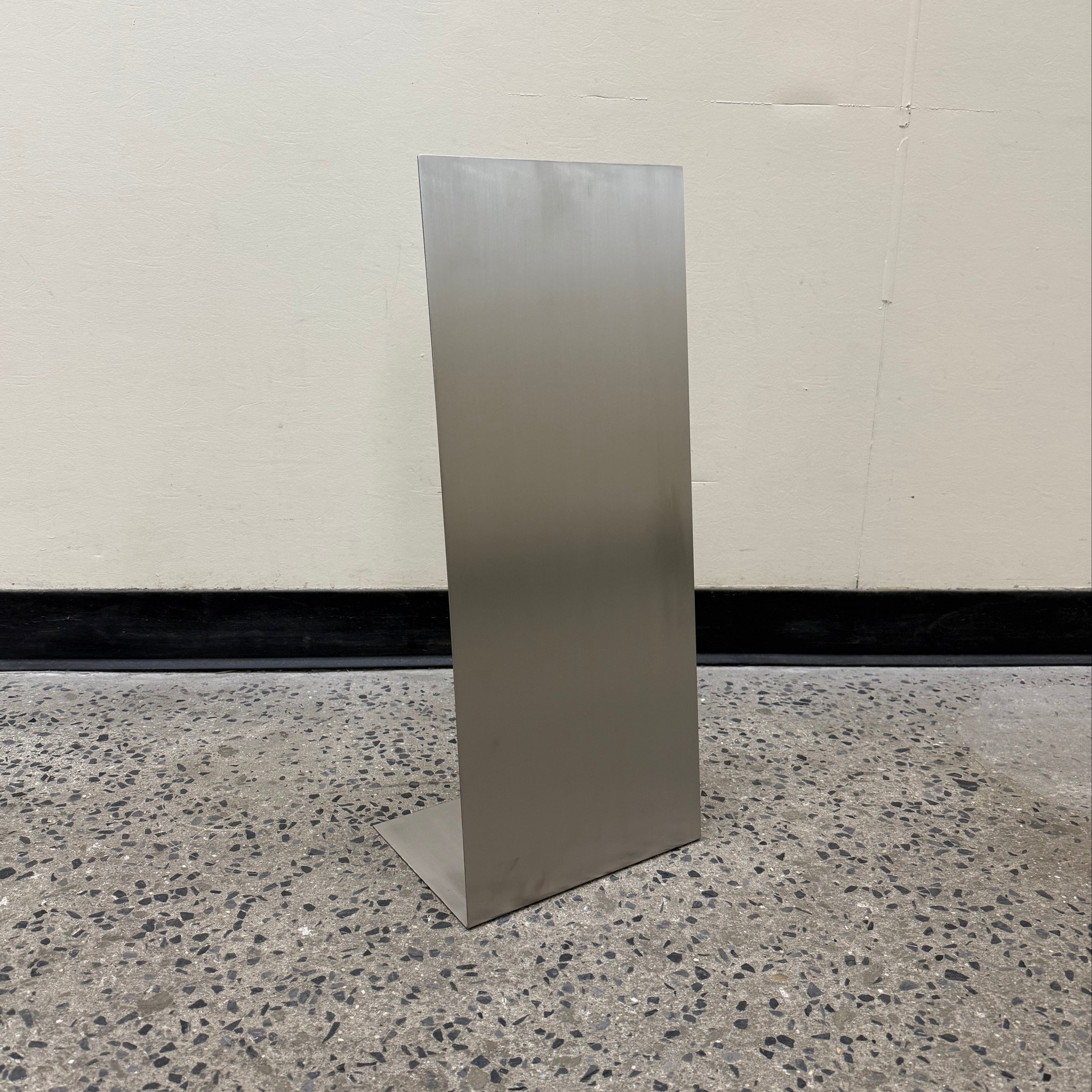 Mini brushed stainless steel floor sign for compact spaces