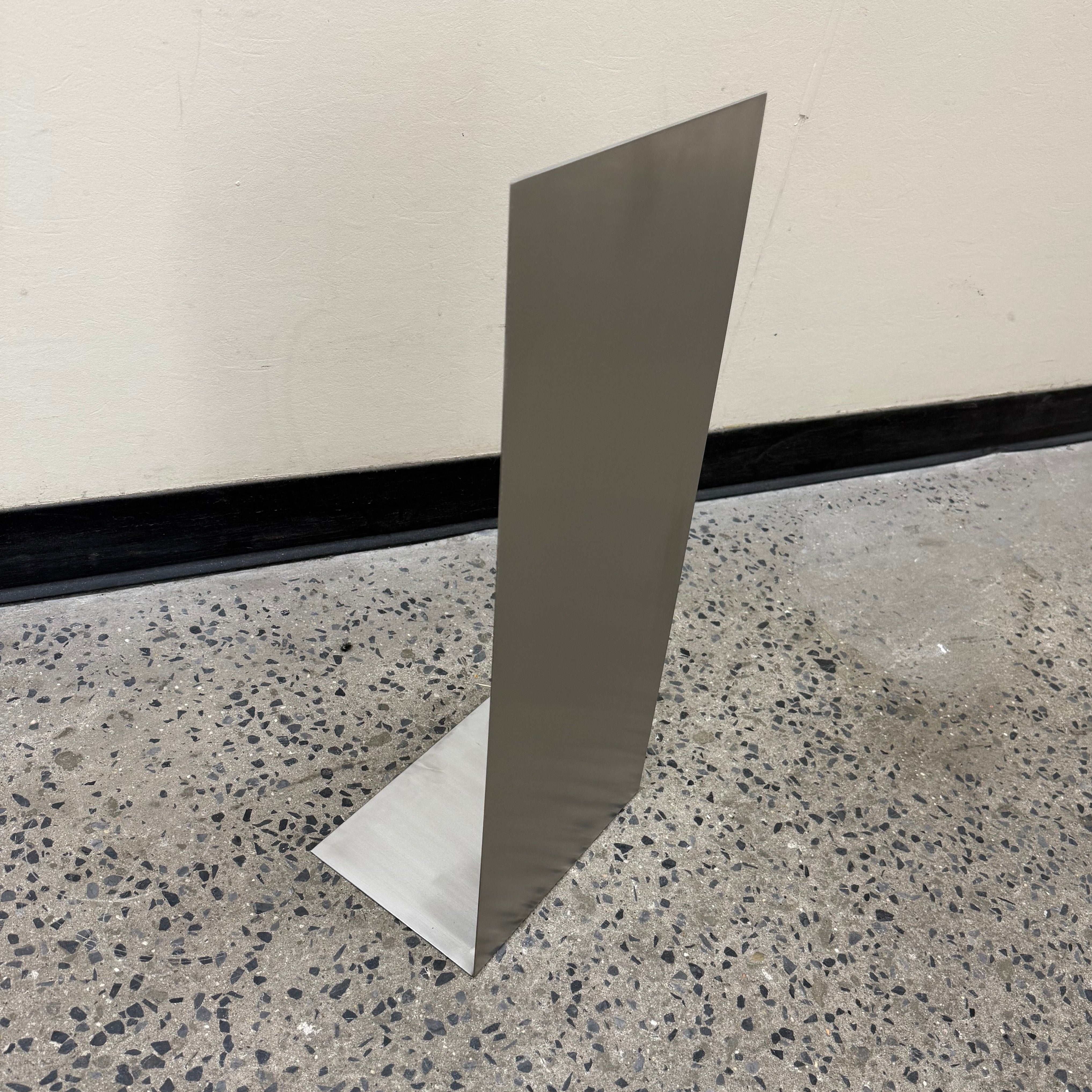 Mini brushed stainless steel floor sign for compact spaces