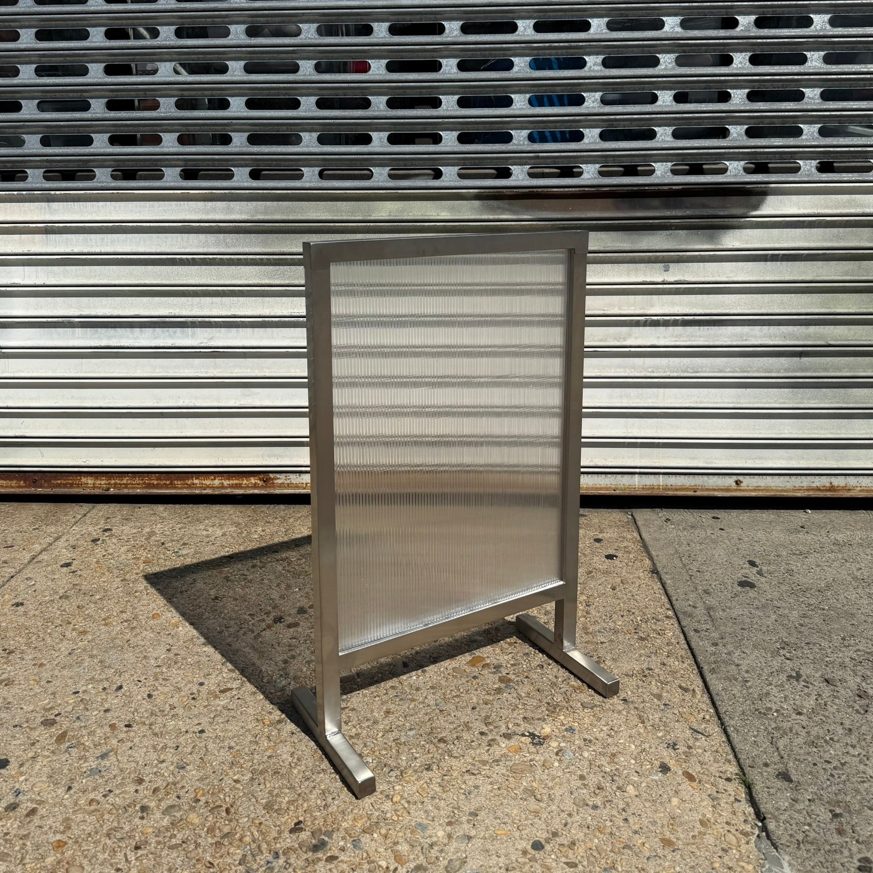 Transparent_Brushed_Stainless_Steel_Standing_Sign_Front_Angle_View