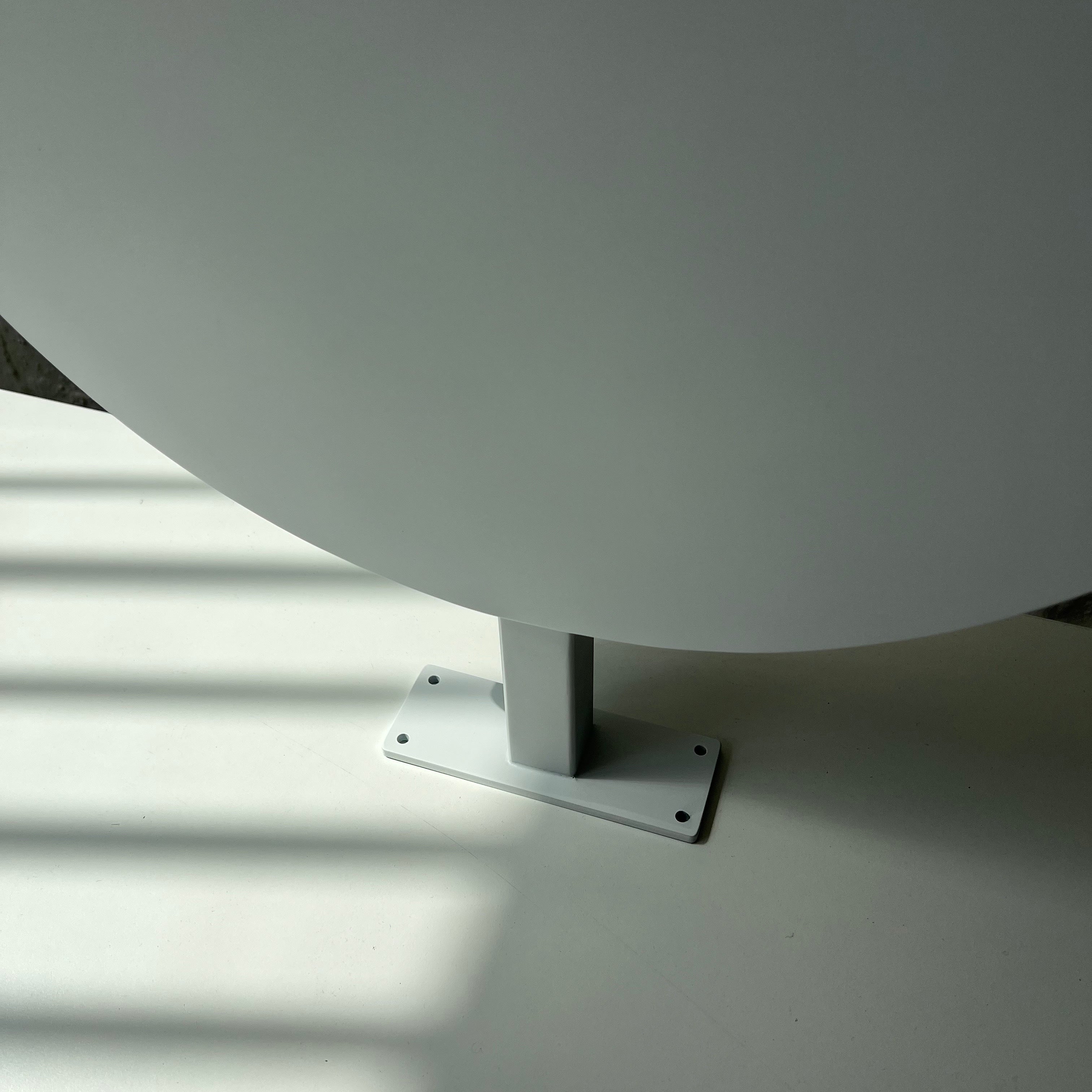 White Circular Round Wall Sign Close Up