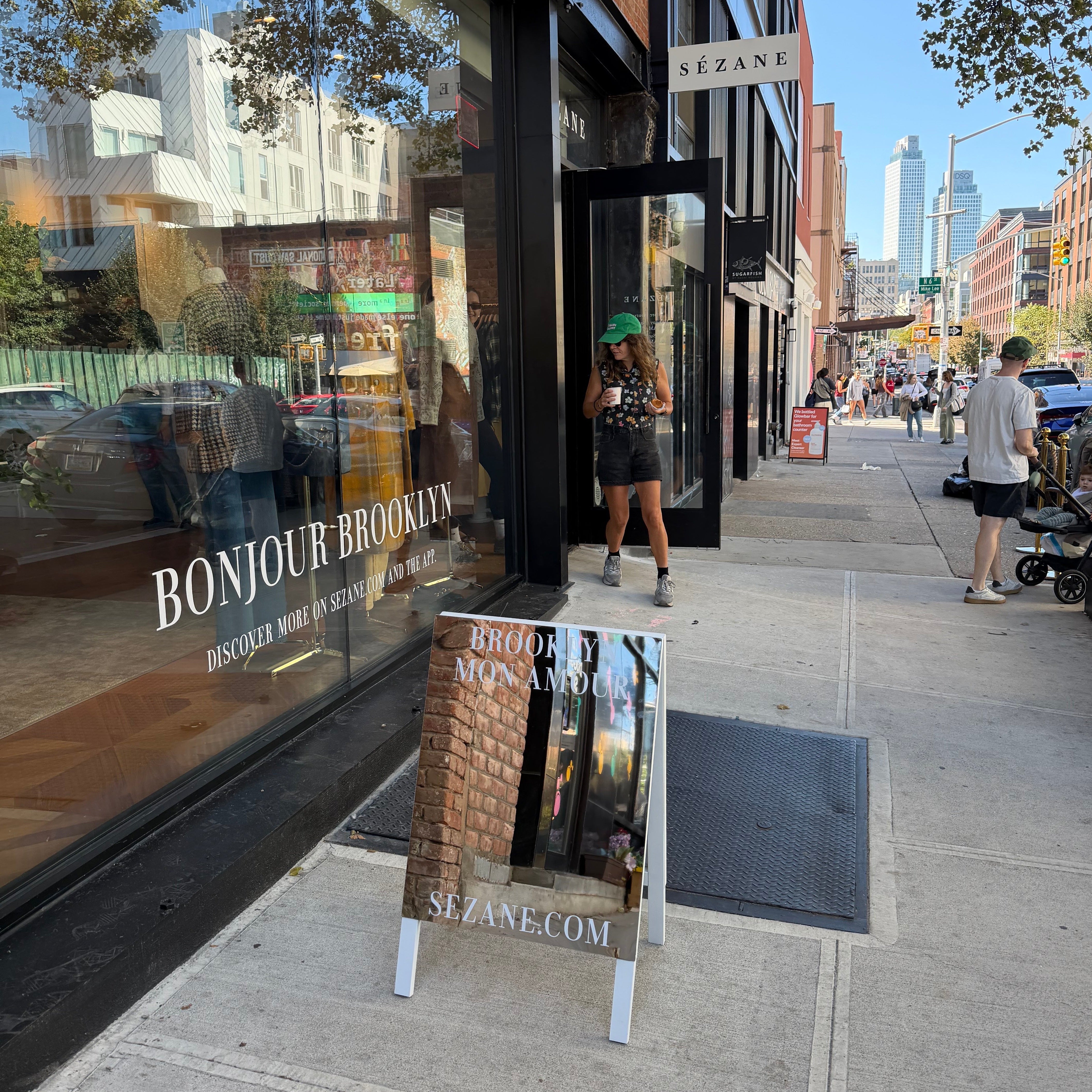 Premium mirrored stainless steel A-frame sandwich board sign for retail storefront