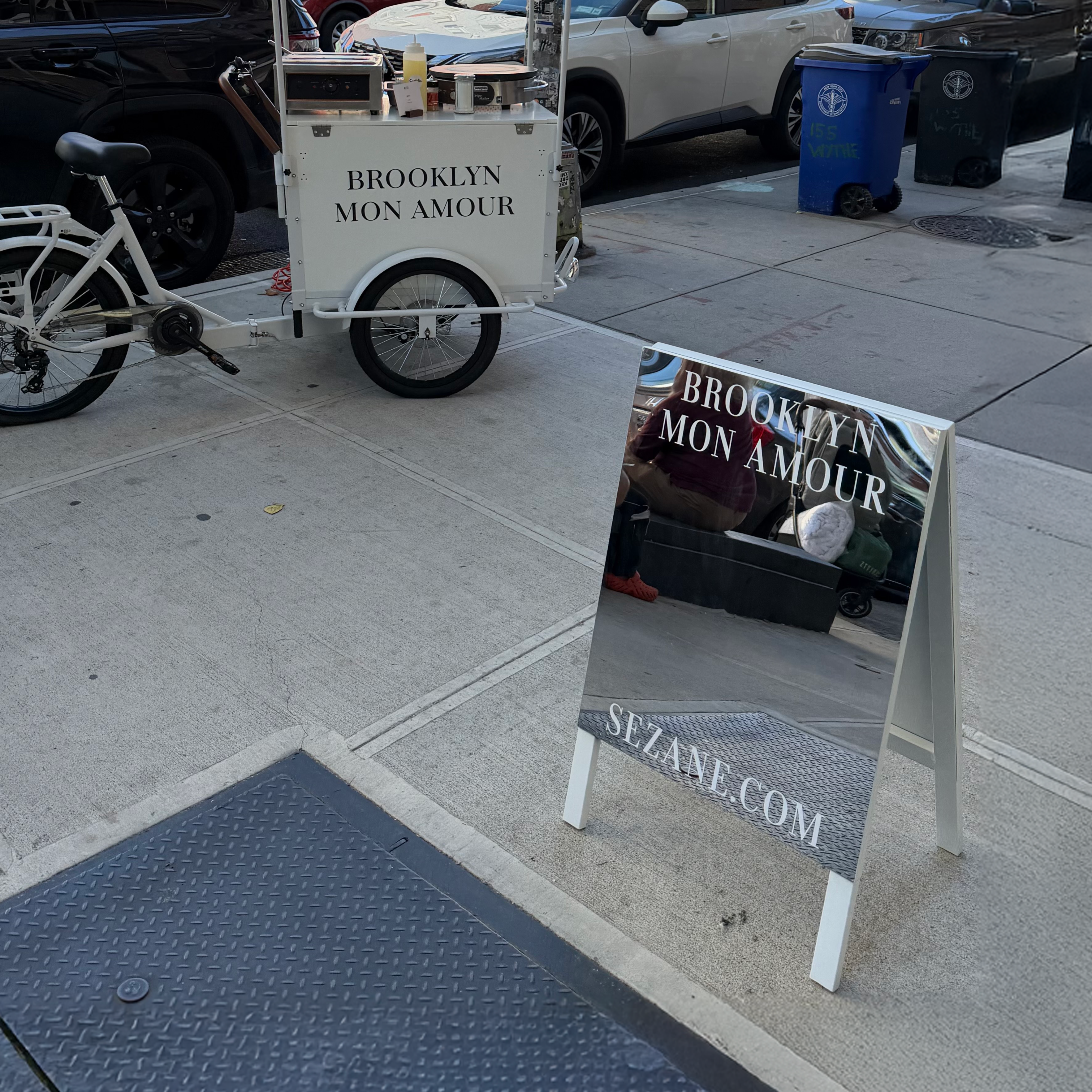 Premium mirrored stainless steel A-frame sandwich board sign for retail storefront