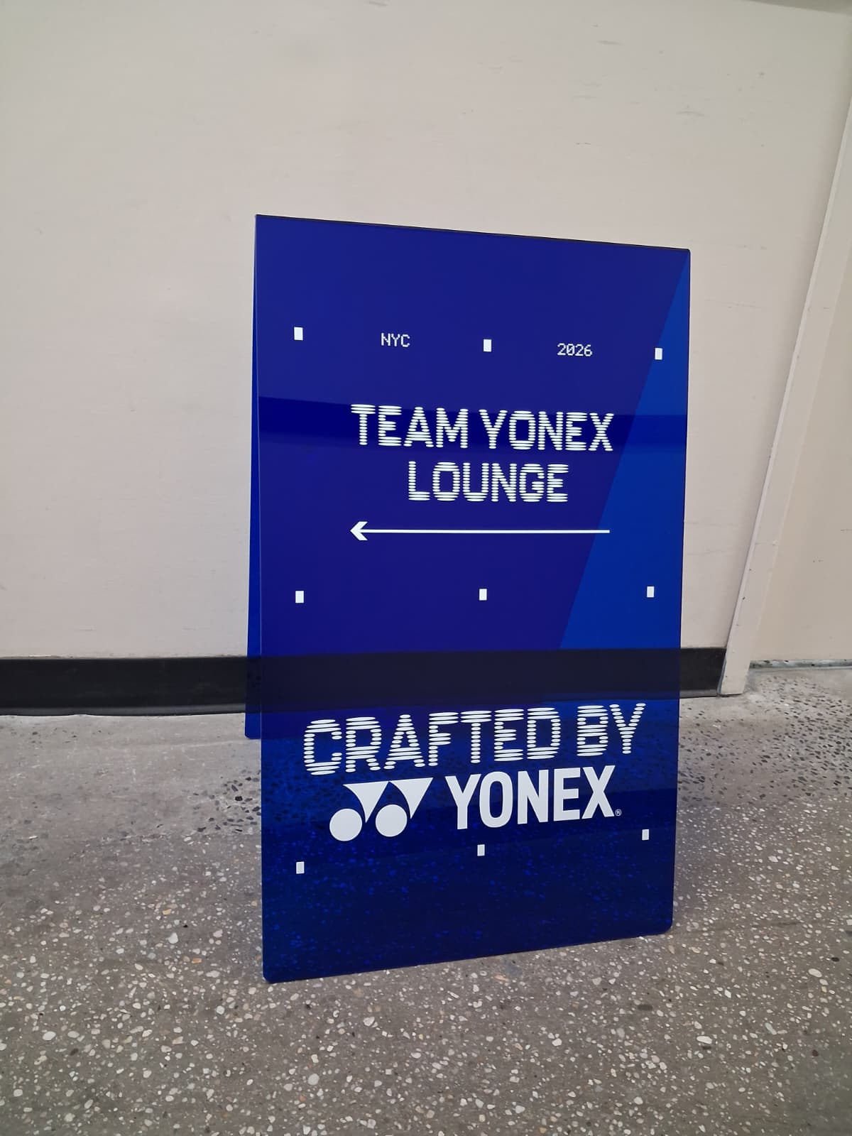 Yonex’s Dark Blue Transparent Acrylic A-Frame Sign