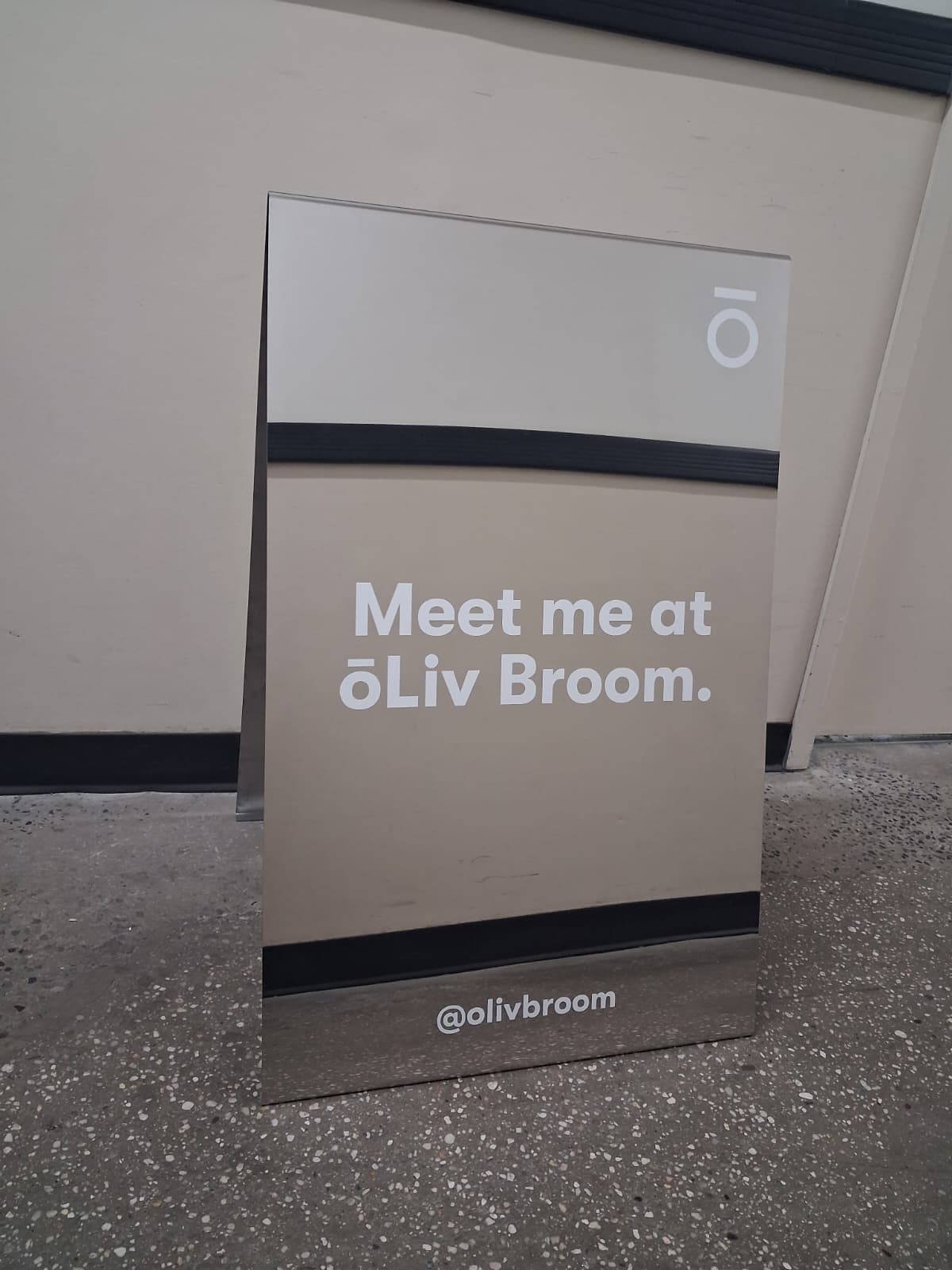 ōLiv Broom’s Custom Mirrored Stainless Steel A-Frame Sign