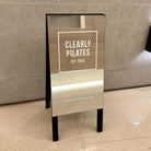 A-Frame Sidewalk Sign Mirrored Clearly Pilates Close Up