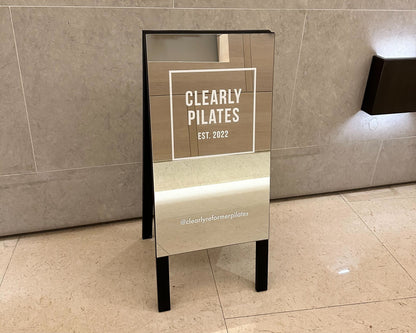 A-Frame Sidewalk Sign Mirrored Clearly Pilates Close Up