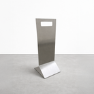 Stainless Steel stand with a rectangular top and square base on a light gray background