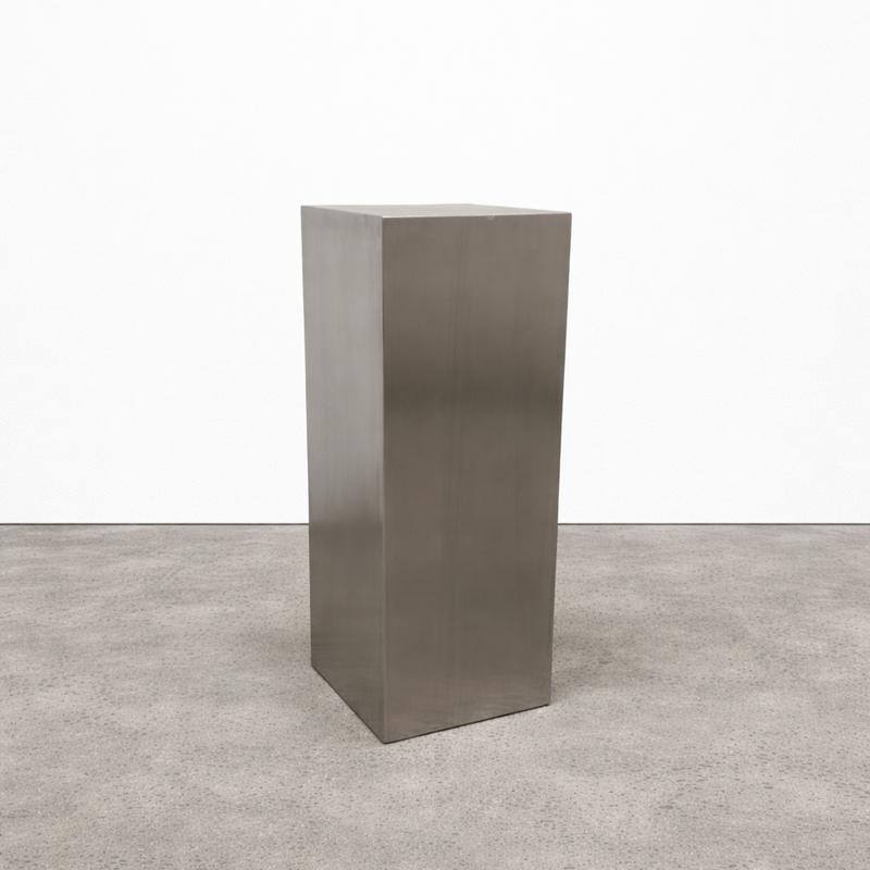 Custom stainless steel pedestals built to display mirrors, signage, and décor. Brushed finish, clean lines, made to order.