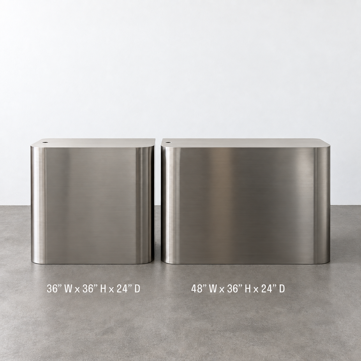 Front comparison of 36-inch-wide and 48-inch-wide stainless steel desks, each 36 inches high and 24 inches deep.