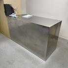 Metal reception desk in an office setting