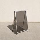 Interchangeable acrylic insert A-frame sign, mirrored frame, Gray Smoke transparent panels