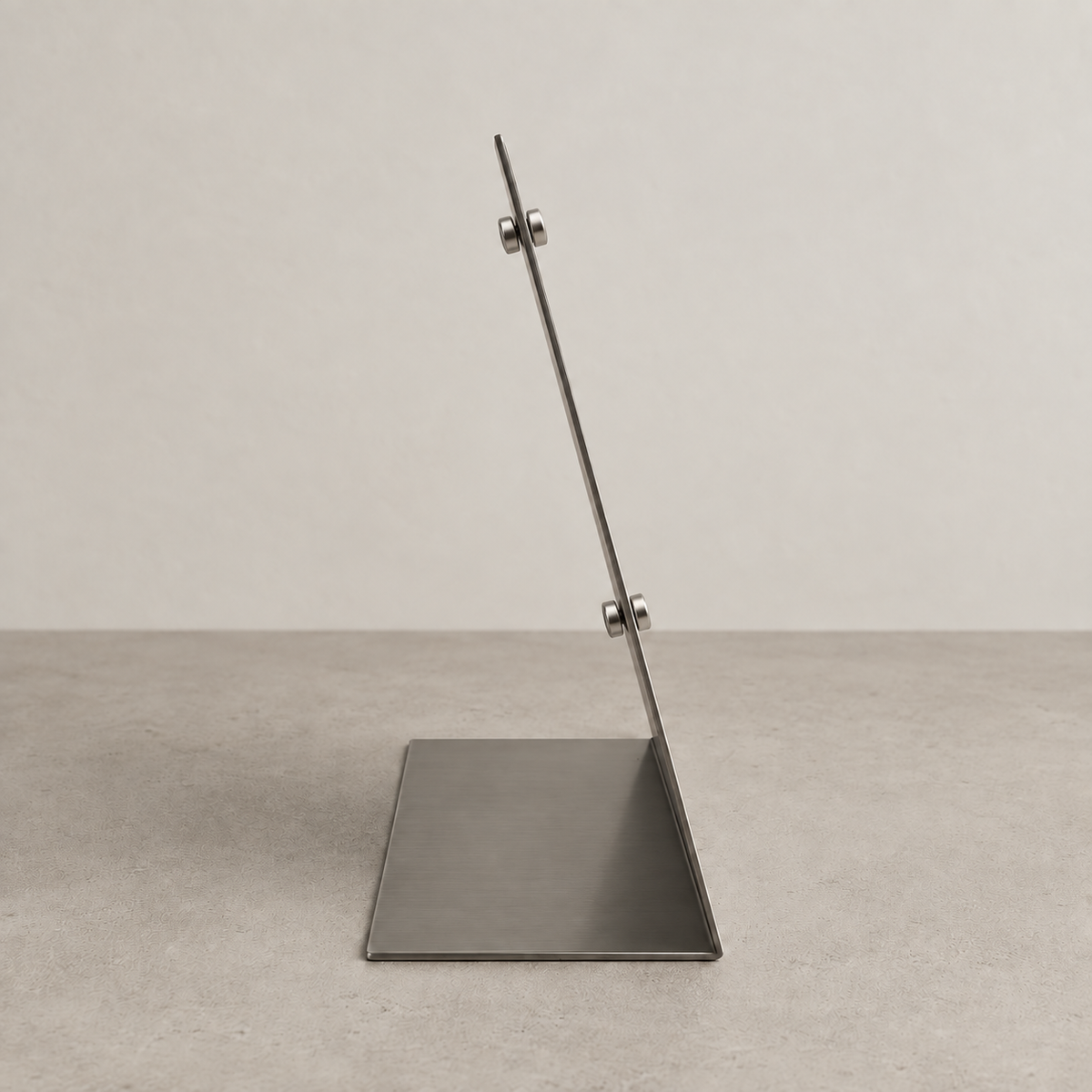Side profile of a stainless steel tabletop stand showing its base and small attached magnets.